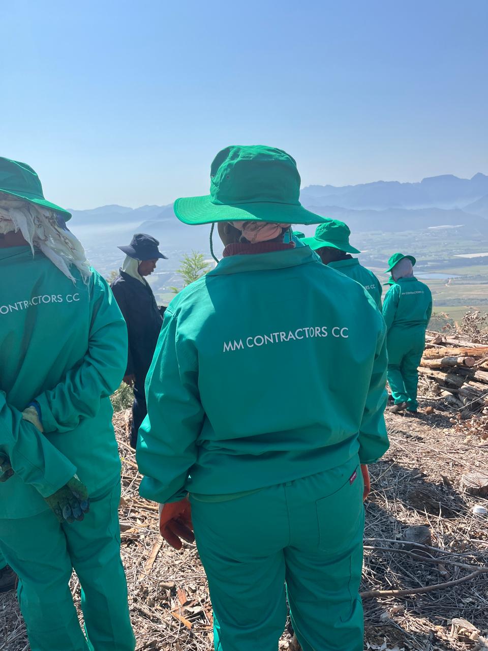 MM Contractors Team wearing uniform jackets