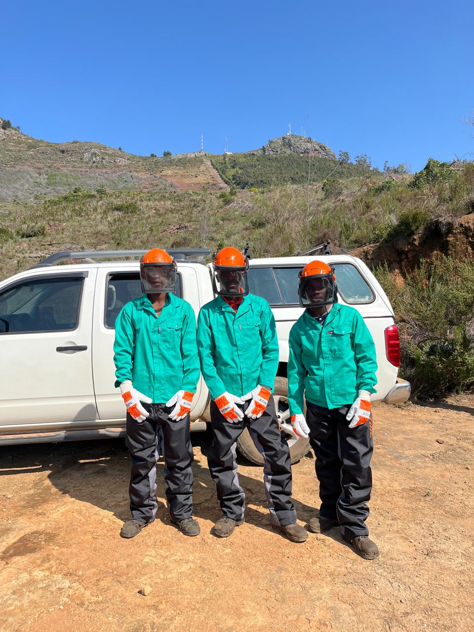 Worker operating safely with chainsaw